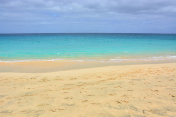 Fototapeta na wymiar Natural background, a beautiful sandy beach and a blue, turquoise sea, ocean