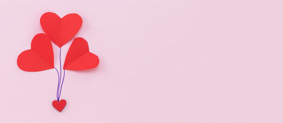 Valentines Day background. Red hearts on pastel pink background. Valentines day concept. Flat lay, top view, copy space