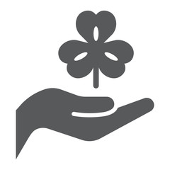 Hand hold lucky clover glyph icon, st patrick's day and holiday, hand holding clover sign, vector graphics, a solid pattern on a white background, eps 10.