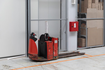 Red Pallet Truck in Warehouse