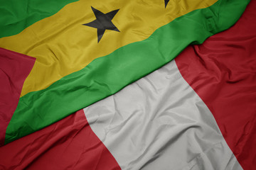waving colorful flag of peru and national flag of sao tome and principe .