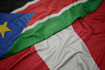 waving colorful flag of peru and national flag of south sudan.