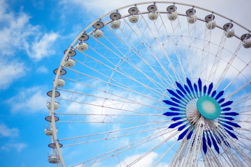 Ferris wheel symbol of Marseille based in old port of Marseille, Provence, France with summer blue sky on background. Ferris wheel children and tourist attraction