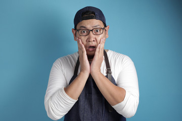 Shocked Asian Chef or Waiter with Mouth Open and Big Eyes