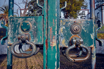 Old door handle on an iron gate.