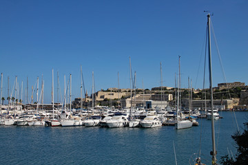 Fototapeta na wymiar Hundreds of yachts are moored in a marina in Malta