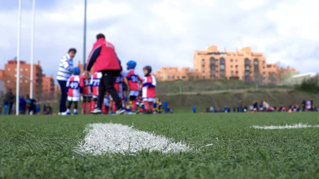 unrecognizable children's rugby tournament, unfocused view