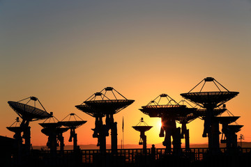 Fototapeta na wymiar Observatory equipment, silhouette at sunrise