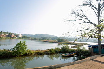 Small canoe on Arpora river. Bardez, Goa, India