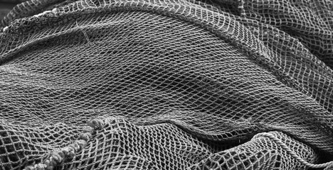 Pile of green fishing nets - Powered by Adobe