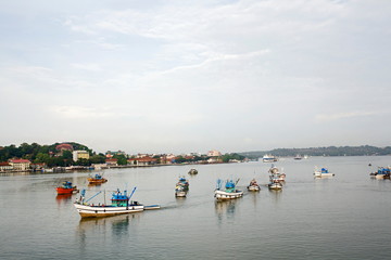 Fototapeta na wymiar Trawlers on the mandovi river in Panjim Goa