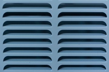 Blue grill of heating radiator.