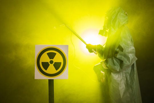 Radiation and danger concept - Man in old protective hazmat suit