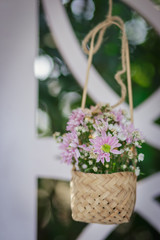 Bouquet of flowers in a decorative pot on the table empty cafe, Filled color filter.