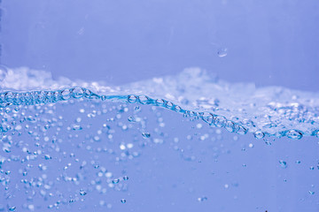Water and air bubbles over white background with space for text.