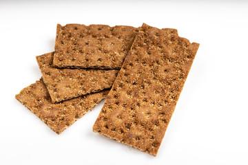 Grain diet light crisp bread lying on a white background