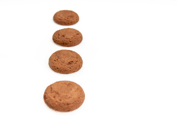 Fototapeta na wymiar Brown chocolate chip cookies with soft tasty filling inside on a white background