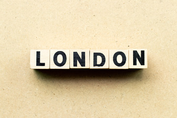 Letter block in word London on wood background