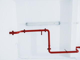 Abstract red pipe on white celing