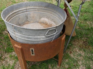 Fototapeta premium Old rin pail in a rusty stand sold at a flea market
