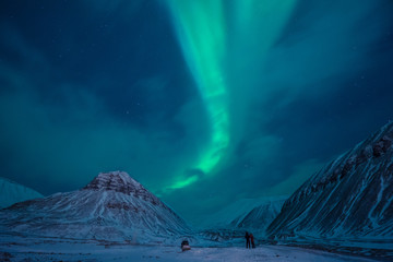 The polar arctic Northern lights aurora borealis sky star in Norway Svalbard in Longyearbyen  with the  mountains. Travel adventure