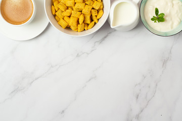 black coffee, cereal, milk and yogurt and place for text