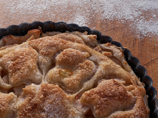 A puff pastry covered lightly sugared apple tart