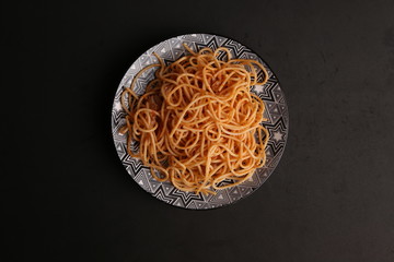 plate of spaghetti pasta with tomato