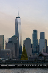 Lower Manhattan New York City Skyline seen from Jersey City with a Christmas Tree during a Sunset
