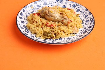 plate of rice with chicken and peppers