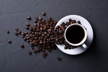 Coffee cup and beans on old grey kitchen beton , rock table. Top view with copyspace for your text