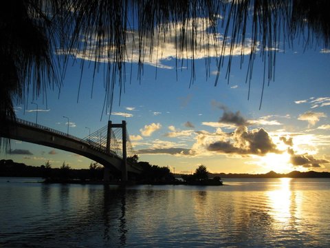 Sunset reflected in the waters at the Japan-Palau Friendship Bridge, seen from the Airai State side.