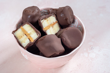 Frozen healthy dessert. Dark Chocolate Peanut Butter Banana Bites
