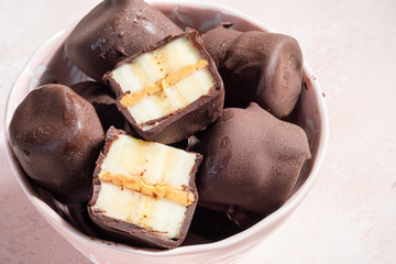 Frozen healthy dessert. Dark Chocolate Peanut Butter Banana Bites