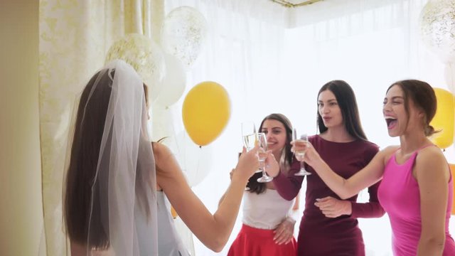 Group of happy beautiful ladies celebrating party at home