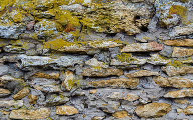 old stone wall with moss and stones