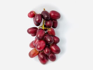 bunch of seedless red grapes isolated on white