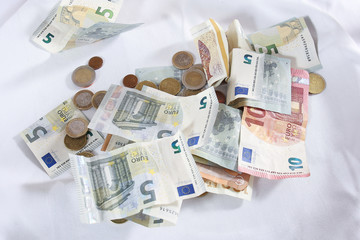 euro banknotes and coins