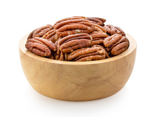Pecans in wood bowl on a white background