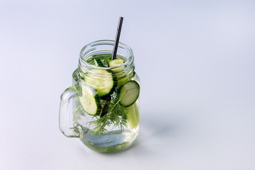 Glass Jar of Tasty Fresh Infused Water Made With Organic Vegetable Cucumber and Celery Healthy Detox Drink