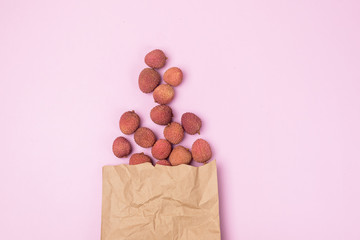Tasty Organic Lychee in Pack on Pink Background Top View Horizontal Asian Fruit