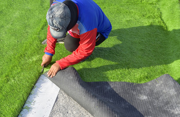 Damaged artificial turf football field
