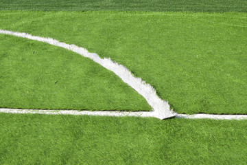 The football field has improved artificial grass.