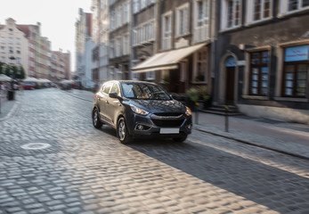 car moves along an old street