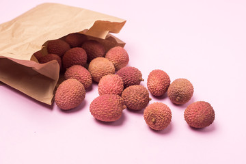 Tasty Organic Lychee in Pack on Pink Background Above Horizontal Asian Fruit