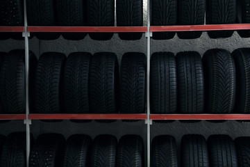 Car tires on rack in auto store