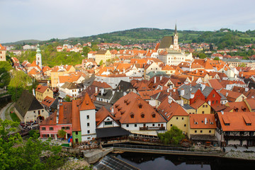 Fototapeta na wymiar Panoramic view of Cesky Krumlov (Czech Republic) from the Castle, with its typical colorful houses and Vltava river at the foreground