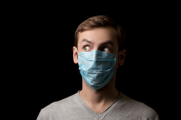 portrait of a masked face against viruses