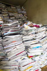 close up view of stacks of paper and magazines and newspapers ready to be recycled