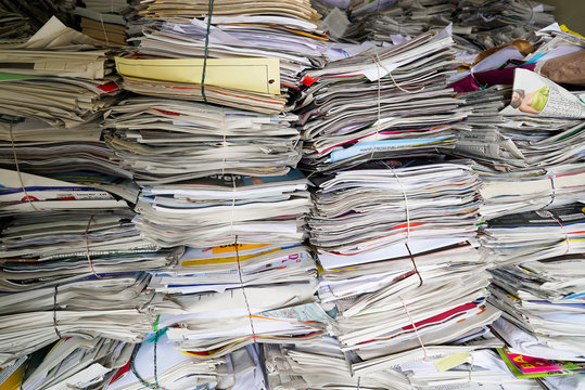 close up view of stacks of paper and magazines and newspapers ready to be recycled